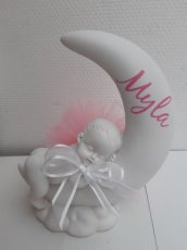 bébé lune Bébé dans plume